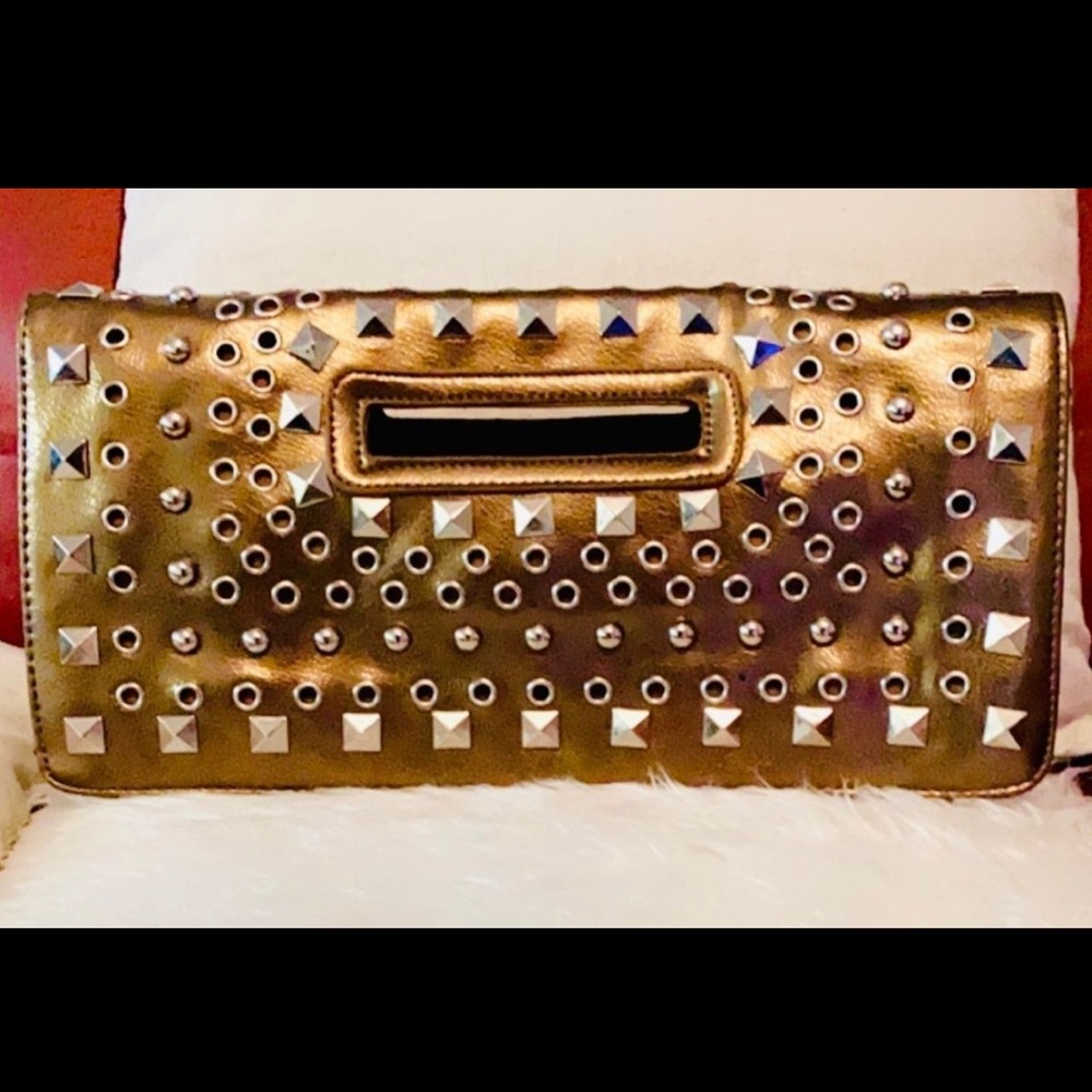 Designed Luxurious Convertible Clutch - Bronze Metallic Python clutch. Oval hand